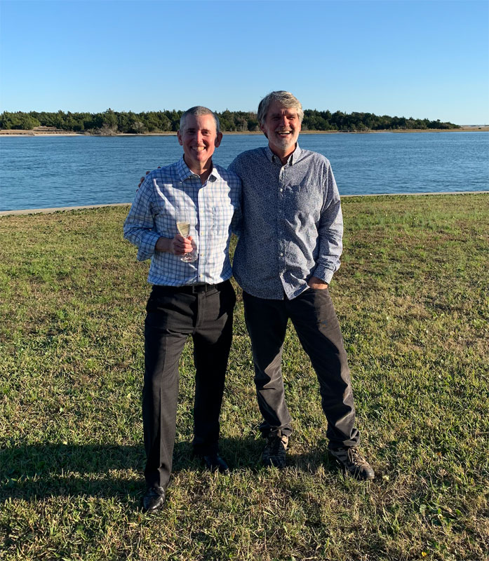 My advisor Doug Nowacek (right) and me (left) at Duke Marine Lab, following the toast celebrating my dissertation defense on November 16, 2021.